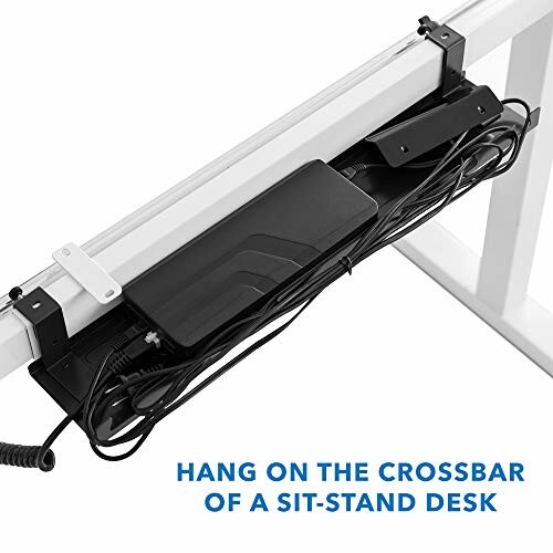 Cable management tray attached to sit-stand desk crossbar.