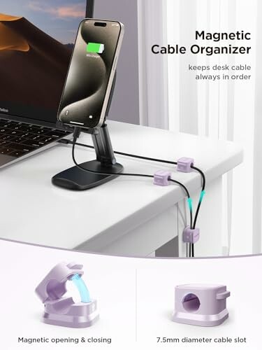 Magnetic cable organizer holding phone and cables on desk.
